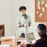 Person leading a presentation in front of a group
