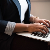 woman typing on computer