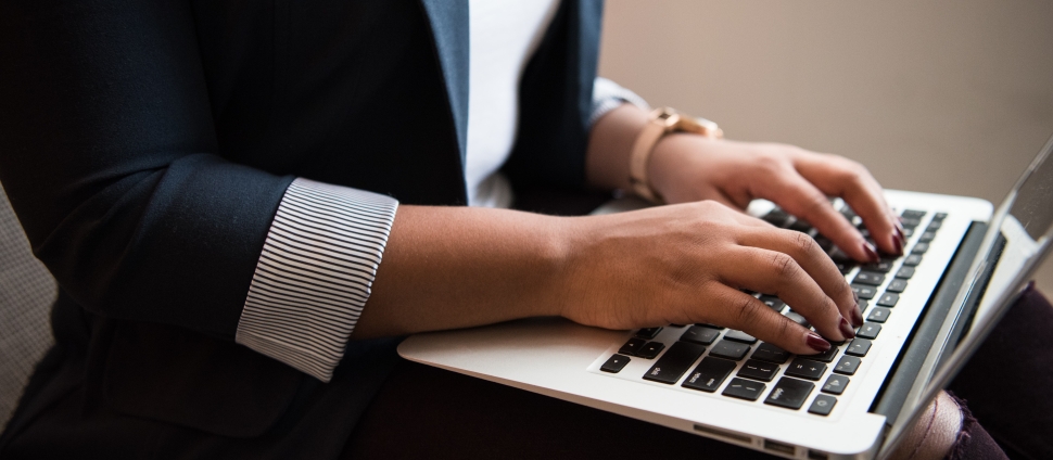 woman typing on computer
