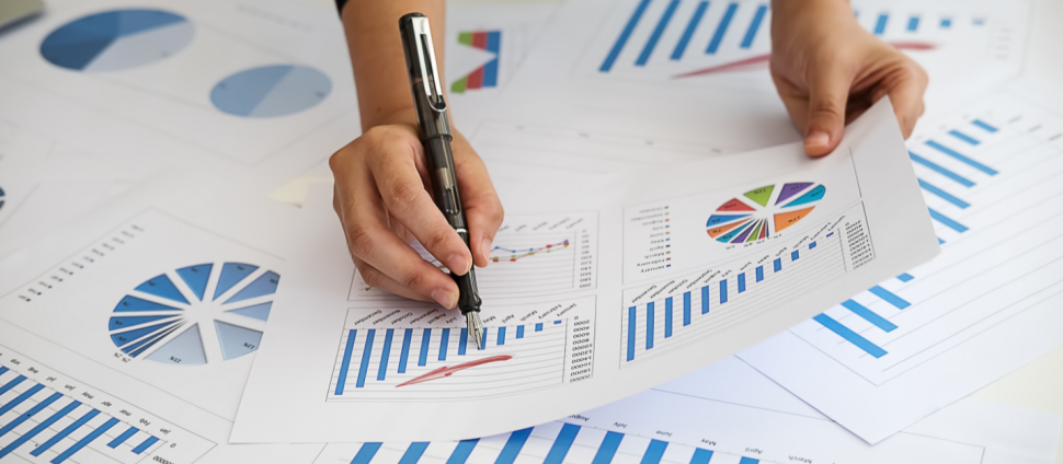 Hands of a person reviewing financial statements