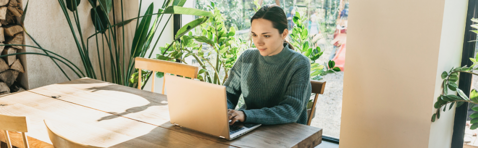 Business woman attends an online webinar from her computer.