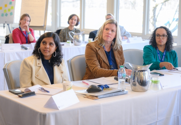 Three women learning in an executive education program.
